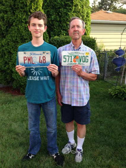 Joe and his dad, Patrick Lynch, holding the original Florida (right) license plate, and the one Patrick used after he received the car from his mom, Irene.