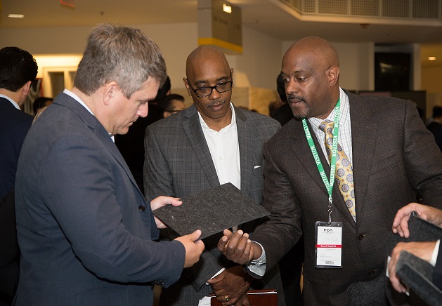 Scott Thiele, Chief Purchasing Officer, FCA, left, Kevin Bell, Head of Diversity Supplier Development and Training, FCA US, center, and Steven Phillips, ConForm Automotive President & CEO, right, talk during the Supplier Matchmaker event on Thursday, September 15, 2016.